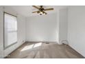 Bright bedroom with carpeted floors and ceiling fan at 535 S Alma School Rd # 45, Mesa, AZ 85210