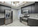 Updated kitchen boasts stainless steel appliances, ample counter space, and stylish cabinetry at 2124 E Osborn Rd, Phoenix, AZ 85016