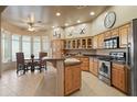 Spacious kitchen with an island and stainless steel appliances at 1580 Calle Simpatico Dr, Wickenburg, AZ 85390