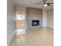 Bright living room with fireplace and tile flooring at 1050 S Stapley Dr # 52, Mesa, AZ 85204