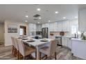Modern kitchen with white cabinets, island, and stainless steel appliances at 6514 N 85Th Pl, Scottsdale, AZ 85250