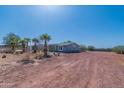 House exterior showing a large yard and desert landscaping at 3718 S 379Th Ave, Tonopah, AZ 85354