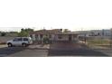 House exterior showing a small, single-story home with a fenced yard at 1202 S 14Th St, Phoenix, AZ 85034