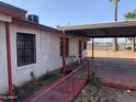 View of the house's side, showcasing a covered patio area at 1202 S 14Th St, Phoenix, AZ 85034