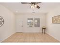 Bright and airy entryway with tile flooring and neutral walls at 22227 S 214Th St, Queen Creek, AZ 85142