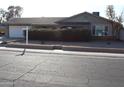 Ranch-style home with front yard landscaping and a spacious driveway at 12236 N 47Th Dr, Glendale, AZ 85304