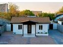 Remodeled craftsman home with a modern exterior, new landscaping, and paved driveway at 1144 E Diamond St, Phoenix, AZ 85006