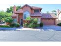 Two-story house with tile roof, attached garage, and well-manicured landscaping at 3907 E Ironwood Dr, Phoenix, AZ 85044