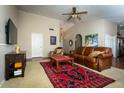 Living room with leather sofas and area rug at 5960 E Grapevine Rd, Cave Creek, AZ 85331