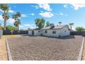 Large backyard with gravel and a partially covered patio at 18001 N 43Rd Way, Phoenix, AZ 85032