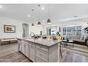 Modern kitchen with an island, stainless steel appliances, and granite countertops at 22698 E Saddle Way, Queen Creek, AZ 85142