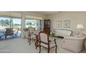 Bright living room with patio access and golf course views at 18364 N Diamond Dr, Surprise, AZ 85374