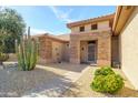 Front entry with stone accents and desert landscaping at 18364 N Diamond Dr, Surprise, AZ 85374