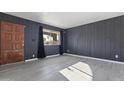 Gray walls, wood-look flooring, and a wood door at 8606 N 32Nd Ave, Phoenix, AZ 85051