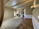 Spacious living room with a fireplace and tile flooring at 7869 E Horseshoe Ln, Scottsdale, AZ 85250