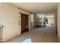 Building hallway with elevator and modern design at 14950 W Mountain View Blvd # 1208, Surprise, AZ 85374