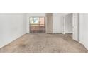 Spacious carpeted bedroom with access to a balcony at 12222 N Paradise Village S Pkwy # 339, Phoenix, AZ 85032