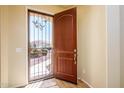 Front entry with decorative security door at 42086 W Solitare Dr, Maricopa, AZ 85138