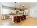 Spacious kitchen with an island, stainless steel appliances, and white shaker cabinets at 18226 W Desert Willow Dr, Goodyear, AZ 85338
