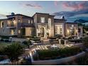 Luxury home with beautiful landscaping at dusk at 9848 E Parkside Ln, Scottsdale, AZ 85255
