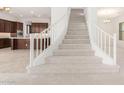 Modern staircase with white railing and carpet at 8628 W Solano Dr, Glendale, AZ 85305