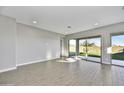 Spacious Gathering room with sliding glass doors leading to the backyard at 19366 W San Juan Ave, Litchfield Park, AZ 85340