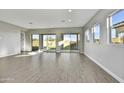 Bright and airy Gathering room with sliding glass doors and backyard access at 19366 W San Juan Ave, Litchfield Park, AZ 85340
