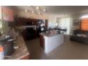 Modern kitchen with granite countertops and island at 2450 W Glenrosa Ave # 12, Phoenix, AZ 85015