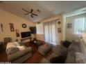 Living room with hardwood floors and sliding doors at 2450 W Glenrosa Ave # 28, Phoenix, AZ 85015
