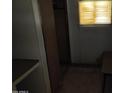 Small bedroom with a closet and window at 65 S Mountain Rd, Apache Junction, AZ 85120