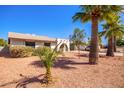 Ranch-style home with desert landscaping and palm trees at 526 E Viola St, Casa Grande, AZ 85122