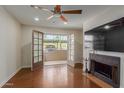 Living room with fireplace, hardwood floors and patio access at 5995 N 78Th St # 1108, Scottsdale, AZ 85250