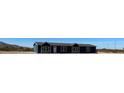 Blue manufactured home with three sections and a small front yard at 11896 N Canyon Ave, Maricopa, AZ 85139