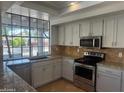 Modern kitchen with granite countertops and stainless steel appliances at 2158 N Yale --, Mesa, AZ 85213