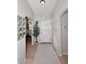 Bright and airy entryway with tile flooring, a mirror, and a view into another room at 3771 E Hazeltine Way, Chandler, AZ 85249