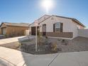 Single-story home with a brown garage door and small front yard at 37517 W San Clemente St, Maricopa, AZ 85138