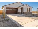 Single-story house with brown garage door and desert landscaping at 37517 W San Clemente St, Maricopa, AZ 85138