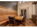 Rustic dining area with wood table and leather bench at 21423 S 147Th St, Gilbert, AZ 85298