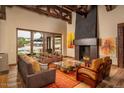 Spacious living room with fireplace and large windows at 21423 S 147Th St, Gilbert, AZ 85298
