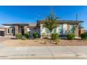 Single-story home with landscaped yard and two-car garage at 5309 N 148Th Ave, Litchfield Park, AZ 85340