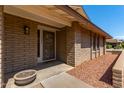 Inviting front entry with decorative door and landscaping at 6034 E Hillview St, Mesa, AZ 85205