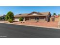 Brick ranch house with two-car garage at 6034 E Hillview St, Mesa, AZ 85205
