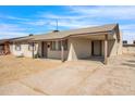 Single-story home with carport and large yard at 7422 W Turney Ave, Phoenix, AZ 85033