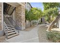 Community walkway and stairs with trees at 2025 E Campbell Ave # 260, Phoenix, AZ 85016
