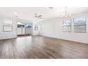 Open living room with sliding glass doors leading to the backyard at 15112 W Hadley St, Goodyear, AZ 85338
