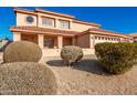 Two-story house with a three-car garage and well-manicured landscaping at 10520 W Patrick Ln, Peoria, AZ 85383