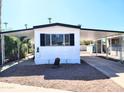 Mobile home exterior with carport and landscaping at 7300 N 51St Ave # F93, Glendale, AZ 85301