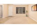 Bright and airy living room with large windows and neutral decor at 2301 E Azalea Dr, Chandler, AZ 85286