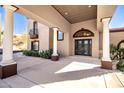 Elegant entryway with columns and a wrought-iron door at 8170 E Golden Spur Ln, Carefree, AZ 85377
