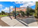 Community playground with shade structure and slides at 578 E Laddoos Ave, San Tan Valley, AZ 85140